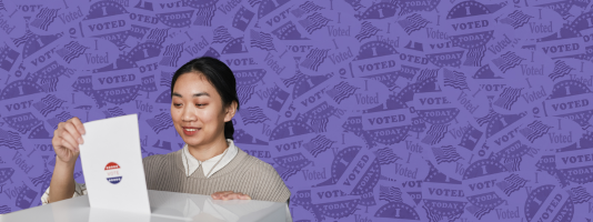 Woman casting her ballot over a background of voting stickers.